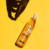 Spray de queratina líquida Byphasse sobre fondo amarillo